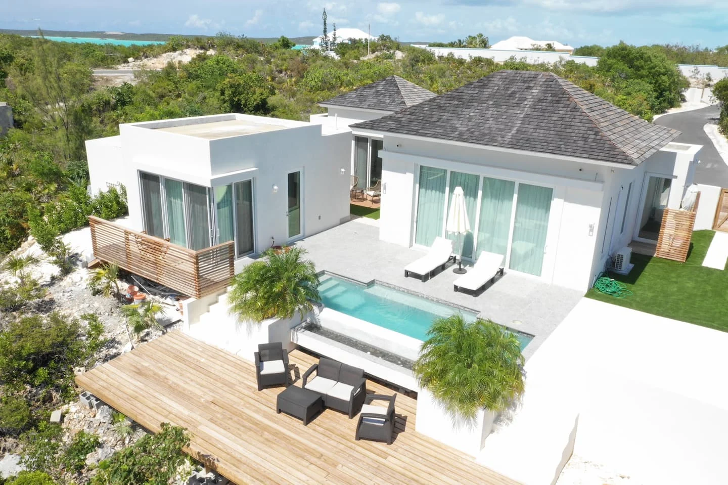 Vista Cove's pool and outdoor terrace beside the main home and detached bedroom